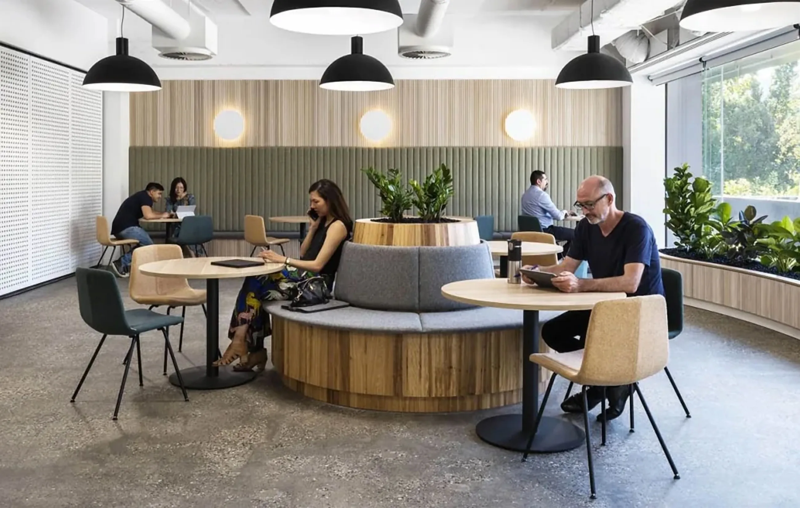 Team collaborating in a Schiavello designed workspace