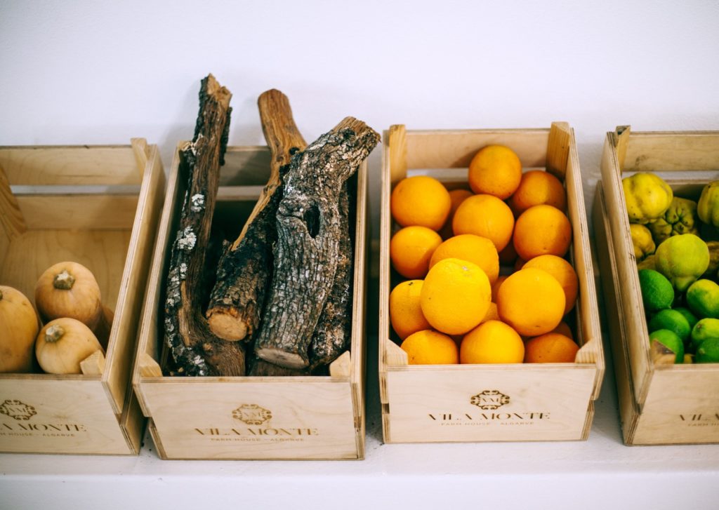 Wooden boxes holding various produce and logs. The key to creating a compelling brand is by creating a good story. 