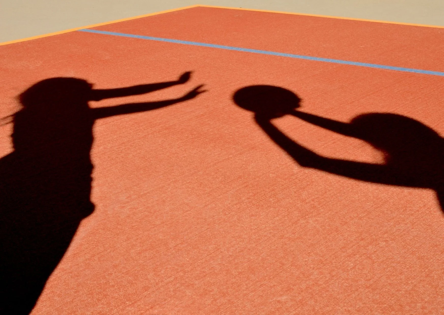 Shadow of Kids Playing Basketball