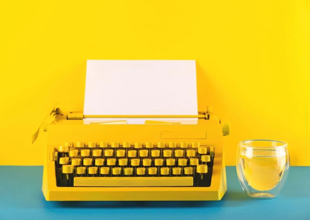 Image shows a yellow typewriter on a yellow background. Sometimes your branding just needs a fresh start. 